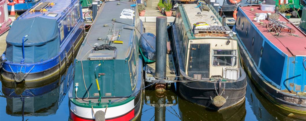 narrowboats moored in a marina canal boats